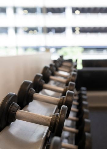 a row of dumbbells in a gym at Sky on Main in MO